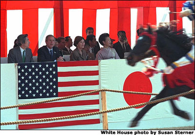 Prime Minister Junichiro Koizumi, far left, President George W. Bush, left, Laura Bush, second right, and Kiyoko Fukuda, far right, wife of the Japanese chief cabinet secretary, watch a demonstration of horseback archery during a visit to the Meiji Shrine in Tokyo, Monday, Feb. 18, 2002. White House photo by Susan Sterner.