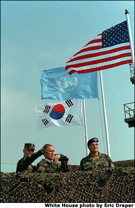 President George W. Bush is given a tour of the North Korean border by Lt. Col. William Miller, left, and General Thomas Schwartz from Observation Post Ouellette near Camp Bonifas in South Korea, Wednesday, Feb. 20, 2002. White House photo by Eric Draper.