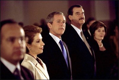 President George W. Bush and Laura Bush stand with Mexican President Vicente Fox and his wife Martha Sahagun de Fox at a dinner hosted by Mexico during a United Nations conference in Monterey, Mexico, Friday, March 22, 2002. White House photo by Eric Draper