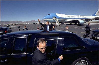 President George W. Bush waves to a crowd of people who came to see him off on his visit to Latin America at his departure from El Paso Thursday, March 21, 2002. White House photo by Eric Draper