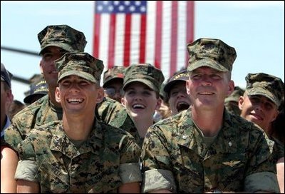 Marines react to remarks by President George W. Bush to military personnel and their families at Marine Air Corps Station Miramar near San Diego, CA on August 14, 2003.