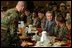 President George W. Bush enjoys lunch with U.S. soldiers at Fort Carson, Colorado Nov. 24, 2003.