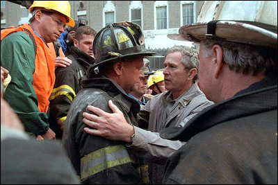 President George W. Bush embraces a firefighter at the site of the World Trade Center during his visit to New York Sept. 14. 