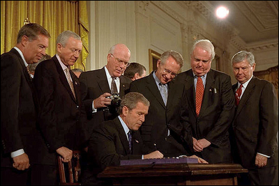 President George W. Bush signs the Patriot Act, Anti-Terrorism Legislation, in the East Room Oct. 26. "With my signature, this law will give intelligence and law enforcement officials important new tools to fight a present danger," said the President in his remarks.
