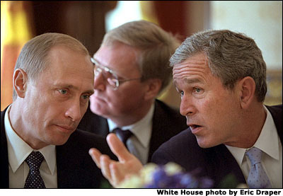 President George W. Bush talks with Russian President Vladimir Putin during a working lunch in the Blue Room at the White House Nov. 13. Following their meetings at the White House, the two Presidents are meeting again at President Bush's ranch in Crawford, Texas. "He'll also get a taste of rural life here in Texas," said the President of the Russian leader's visit. "He'll get to see Houston, and he's also going to get to come to Crawford." White House by Eric Draper.