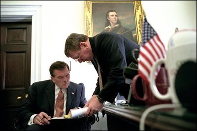 Governor Ridge talks with Attorney General John Ashcroft outside the Oval Office Nov. 28, 2001. Coordinating intelligence efforts with the FBI, CIA and Justice Department, Secretary Ridge meets routinely with his colleagues.
