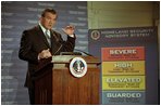 Governor Tom Ridge announces the Homeland Security Advisory System designed to measure and evaluate terrorist threats in Washington, D.C., March 12, 2002. It is based on threat conditions of five different alerts: low (green), guarded (blue), elevated (yellow), high (orange) and severe (red). 