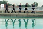 Traveling with President Bush, Governor Ridge tours a water treatment plant in Kansas City, Mo., with EPA Administrator Christie Todd Whitman, center left, and Education Secretary Rod Paige, center right, June 11, 2002.