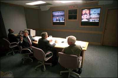 President George W. Bush, White House Chief of Staff Andy Card (left) and Admiral Richard Mies conduct a video tele-conference at Offutt Air Force Base in Nebraska, Sept. 11, 2001.