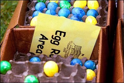 Easter Eggs in rain-soaked cartons lay on the South Lawn during a rainy Easter Egg Roll April 12, 2004. 