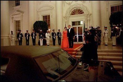Ending an evening filled with with friendship, fine food and fireworks, President Bush and Mrs. Laura Bush say goodbye Mexican President Vicente Fox and his wife Martha Sahagun de Fox at the North entrance of the White House.
