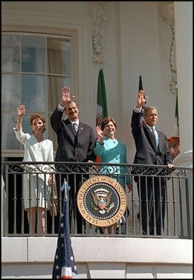 Waving from the White House balcony, President Bush welcomes Mexican President Vicente Fox during the President's First State Visit Sept. 6.