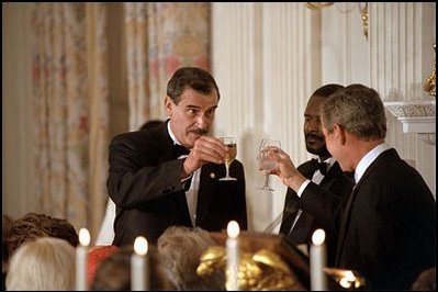 Presidents Fox and Bush toast each other at the state dinner Wednesday evening at the White House. During their remarks following the salutations, President Fox remarked that he was "honored, pleased to be here, close to my friend, Jorge." In his remarks, President Bush said Fox's visit was "like a family gathering."