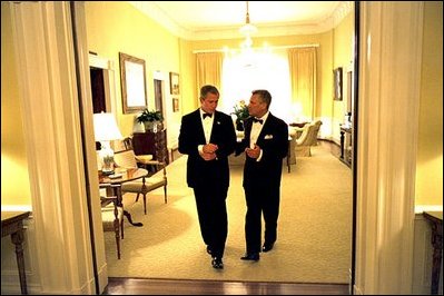 Before greeting guests, President Bush invites President Kwasniewski into the private residence of the White House. White House photo by Eric Draper.