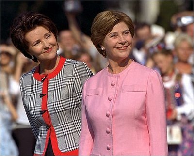 Mrs. Bush and Mrs. Kwasniewska stand together during the South Lawn ceremony at which the national anthems for both countries were performed and their husbands reviewed the troops.