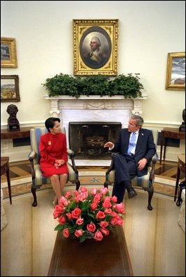 Proceeding from public ceremony to private talks, Philippine President Gloria Macapagal-Arroyo and President George W. Bush meet in the Oval Office Monday, May 19, 2003. 