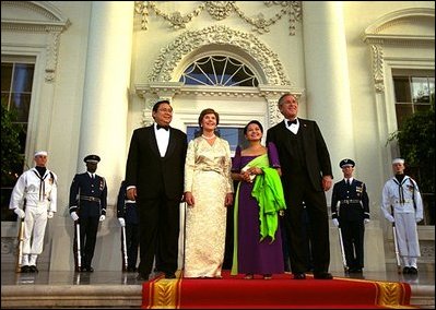 Arriving for the State Dinner President George W. Bush, Philippine President Gloria Macapagal-Arroyo, her husband Jose Miguel Arroyo and Laura Bush greet the press from the North Portico of the White House Monday, May 19, 2003. 