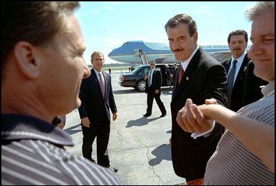 Moments after landing, Presidents Fox and Bush greet a welcoming crowd at Toledo, Ohio, Sept. 6. It was the second day of activities during Fox's trip to America.