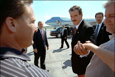 Moments after landing, President Vicente Fox greets people during his and President Bush's arrival in Toledo, Ohio, Thursday afternoon. It was the second day of activities during Fox's visit to America. White House photo by Eric Draper.
