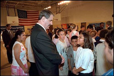 At the Aurora Gonzales Community and Resource Center in Toledo, Ohio, President Fox talks with a student. At the center, the Presidents spoke with kids and adults alike, and also played foosball, pool and basketball.