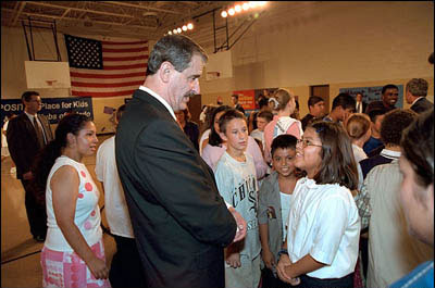 At the Aurora Gonzales Community and Resource Center in Toledo, Ohio, President Fox talks with a student. At the center, the Presidents spoke with kids and adults alike, and also played foosball, pool and basketball. White House photo by Eric Draper.