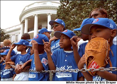 The Memphis Red Sox of the Satchel Paige Little League in Washington, D.C. watch as the President arrives. White House photo by Eric Draper.