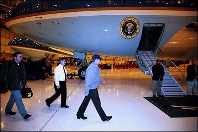 President George W. Bush leaves for a secret mission to visit troops in Baghdad Nov. 26, 2003. The President is accompanied by Communications Director Dan Bartlett, far left, and Chief of Staff Andrew Card.