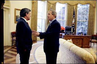 President George W. Bush talks alone with Presidential Envoy to Iraq Paul Bremer in the Oval Office Jan. 16, 2004.