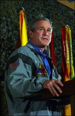 President George W. Bush delivers remarks to troops on Thanksgiving Day in Baghdad, Iraq. Thursday, November 27, 2003.