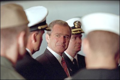 President George W. Bush meets with military personnel aboard the USS Enterprise in Norfolk, Va., Dec. 7, 2001. "When America looks at you, the young men and women who defend us today, we are grateful," said the President. "On behalf of the people of the United States, I thank you for your commitment, your dedication and your courage." 