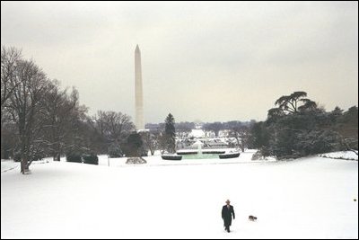 The President takes a walk in the snow on the South Lawn with his dog, Spot, Thursday, Dec. 5, 2002. 