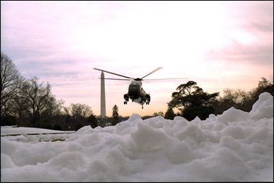 Marine One arrives from Camp David and lands on the South Lawn in an area cleared of snow, Sunday, Dec. 8, 2002. 