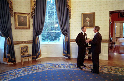 A few hours before addressing Congress and the nation, President Bush talks privately with British Prime Minister Tony Blair in the Blue Room at the White House, Thursday, Sept. 20.