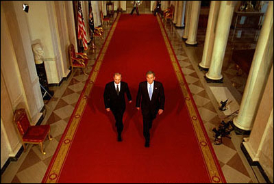 President George W. Bush and Russian President Vladimir Putin walk out to address the media at the White House Nov. 13. "This is a new day in the long history of Russian-American relations, a day of progress and a day of hope," said President Bush in his remarks. 