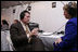Secretary Michael O. Leavitt of the Department of Health and Human Services, speaks with radio journalist Sue Henry of radio station WILK in Scranton, Wilkes Barre, Pa., at White House Radio Day Tuesday, Oct. 24, 2006.