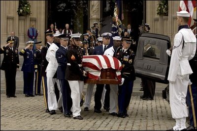 The casket of former President Ronald Reagan is loaded into a hearse at the funeral service at the National Cathedral in Washington, DC on June 11, 2004. 