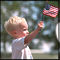A child waves an American Flag
