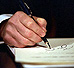 President George W. Bush participates in his first signing ceremony on January 20, 2001, setting his agenda in motion.
