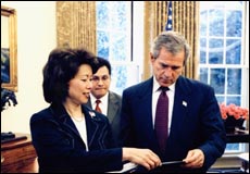 Photo of President Bush with Secretary of Labor Elaine Chao