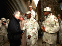 Secretary of Defense Don Rumsfeld meets with soldiers.