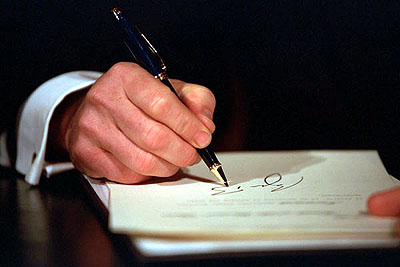 President George W. Bush participates in his first signing ceremony on January 20, 2001, setting his agenda in motion.