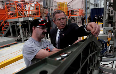 President George W. Bush works with Boeing Employee Rocky Mayberry during a tour of the Boeing F-18 Production Facility in St. Louis, Mo., April 16, 2003.