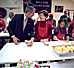  President George W. Bush talks with a volunteer at Martha's Table in Washington, D.C., December 20, 2001. A strong advocate of volunteerism, President Bush has challenged all Americans to donate 4,000 hours of community service during their lifetime.