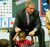 President George W. Bush visits with children at Highland Park Elementary School's Head Start Center in Landover, Md., July 7, 2003.