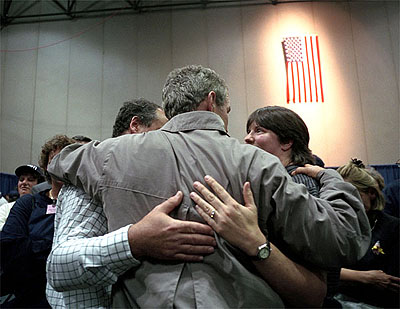 President Bush consoles a family during his trip to New York September 14, 2001.