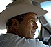 Driving along dusty roads at his ranch, President Bush gives a tour of his home in Crawford, Texas, August 7, 2001. 