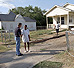 President George W. Bush visits with Waco, Texas residents after participating in a Habitat for Humanity home build on August 8, 2001. 