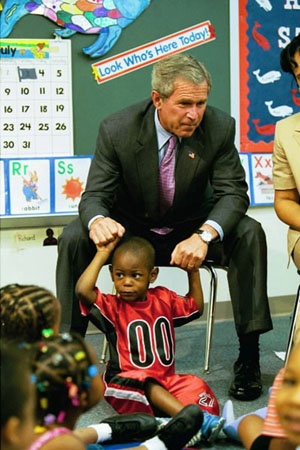 President George W. Bush visits with children at Highland Park Elementary School's Head Start Center in Landover, Md., July 7, 2003. 
