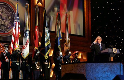 President George W. Bush salutes guests attending a pre-inaugural event honoring the men and women of the U.S. military at the MCI Center in Washington, D.C., Tuesday, Jan. 18, 2005. Fourteen thousand guests attended the event, including 7,000 military service members, wounded soldiers from Walter Reed Army Medical Center, families of fallen soldiers and Congressional Medal of Honor winners.White House photo by David Bohrer