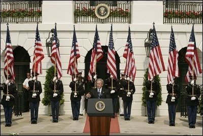 President George W. Bush gestures as he addresses guests on the South Lawn of the White House, Friday, Sept. 9, 2005, during the 9/11 Heroes Medal of Valor Award Ceremony and to honor the courage and commitment of emergency services personnel who died on Sept. 11, 2001.